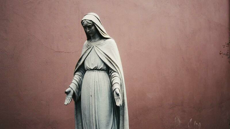Statue of the Blessed Virgin Mary looking contemplative