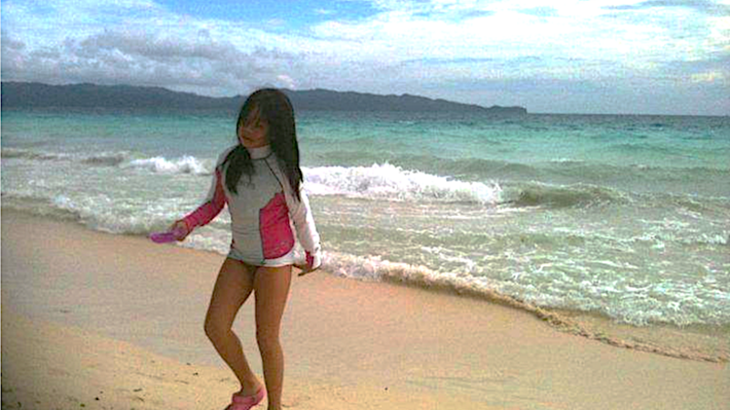 The author in her youth, on the sandy beaches of Boracay