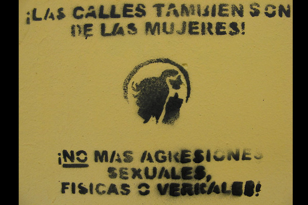 A poster in Spanish reading "The streets, also, are for women! No more sexual-abuse, physical or verbal violence."