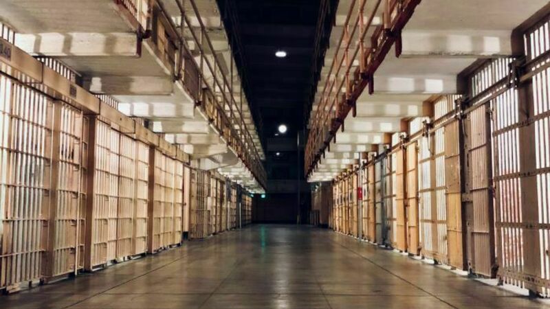 a multilayered range of prison cells