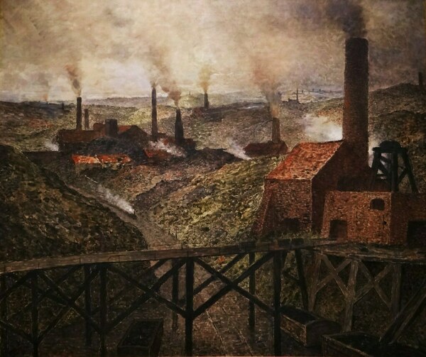 a landscape with factories belching smoke