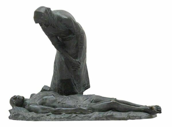 a sculpture of the Blessed Virgin hunched over the body of her son