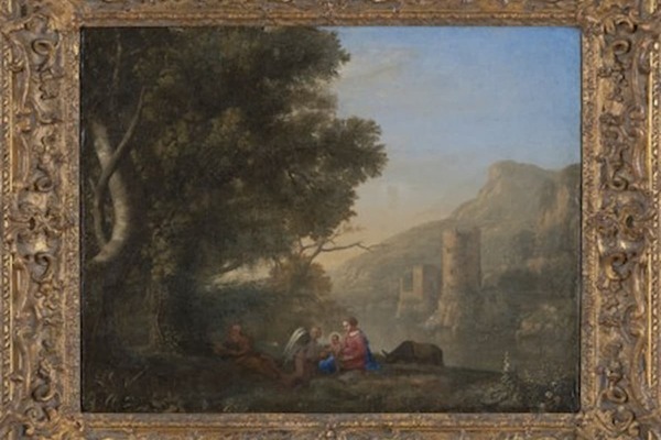 a framed painting of the Holy Family at rest under a tree with Mary handing the Christ Child to an angel habitations and a mountain in the background